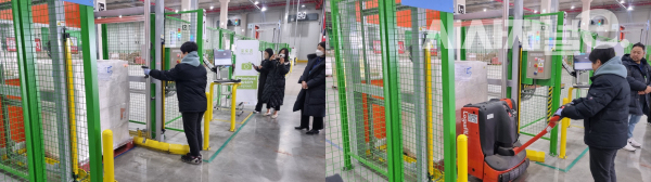 직원이 무인지게차에 바코드를 스캔하는 모습. / 사진=한다원 기자